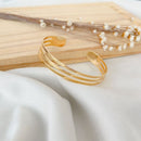 BRACELETE ABERTO TRÊS FIOS DOURADO