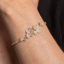 PULSEIRA DE LAÇOS CRAVEJADOS DE ZIRCÔNIAS CRISTAIS BANHO OURO 18K