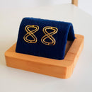 BRINCO OITO BANHADO OURO 18K